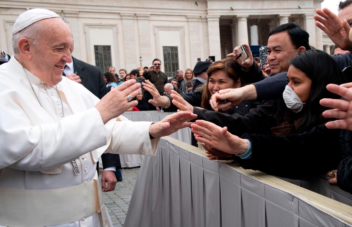 Pope Francis greets catholic faithfuls at St. Peter's square in the Vatican at the end of his weekly general audience on Feb. 26, 2020. (Tiziana FABI/ AFP)