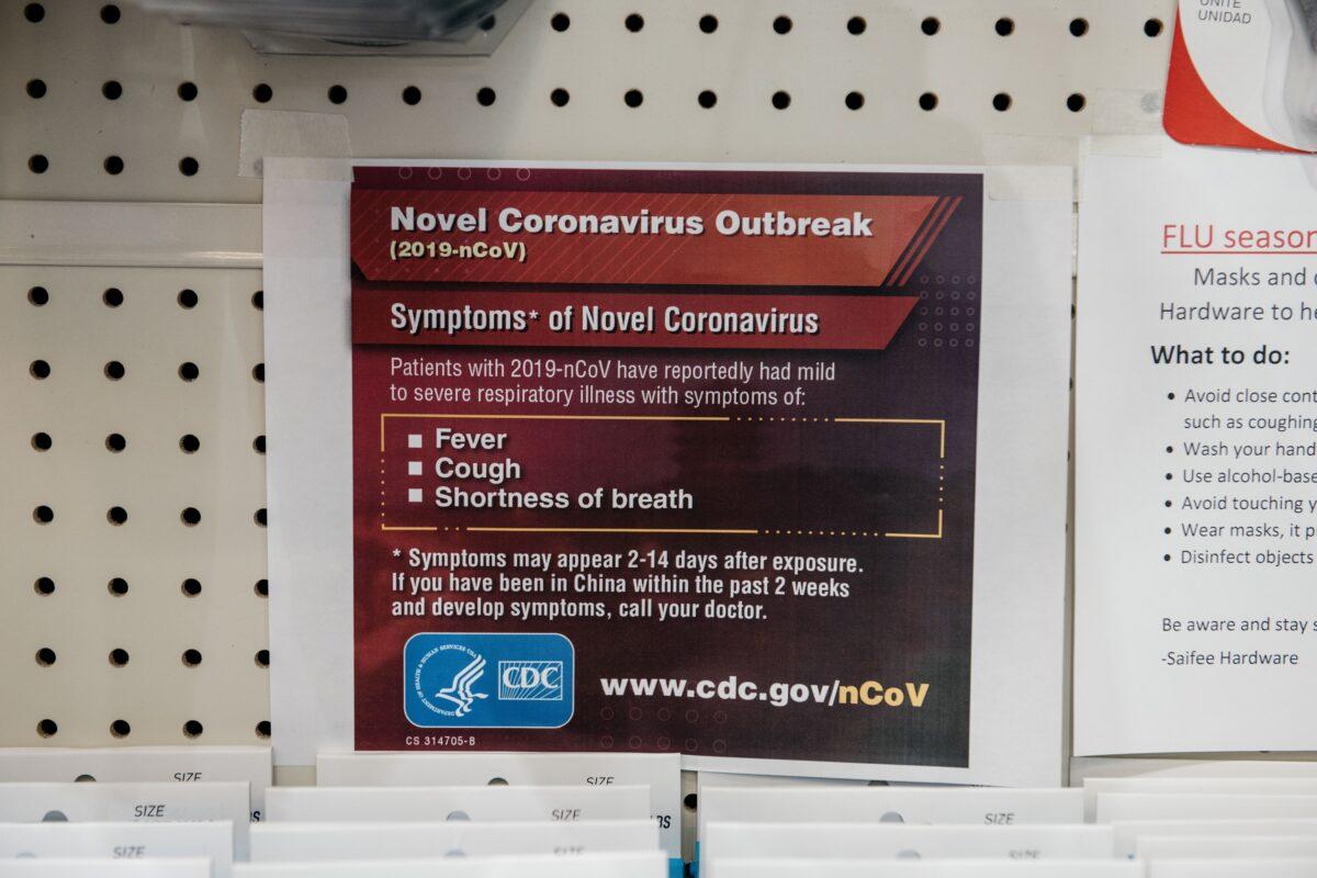 Signs detailing the Center for Disease Control's advice for combating coronavirus are displayed above face masks at a Manhattan hardware store in New York City on Feb. 26, 2020. (Scott Heins/Getty Images)