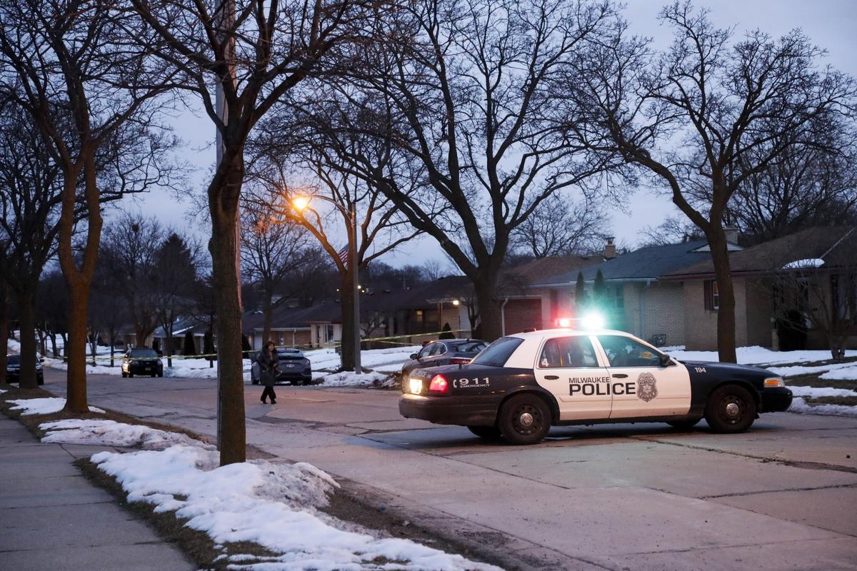Police are seen outside of a house near Potomac and Courtland after a shooting at Molson Coors on Feb. 26, 2020, in Milwaukee. (Morry Gash/AP)
