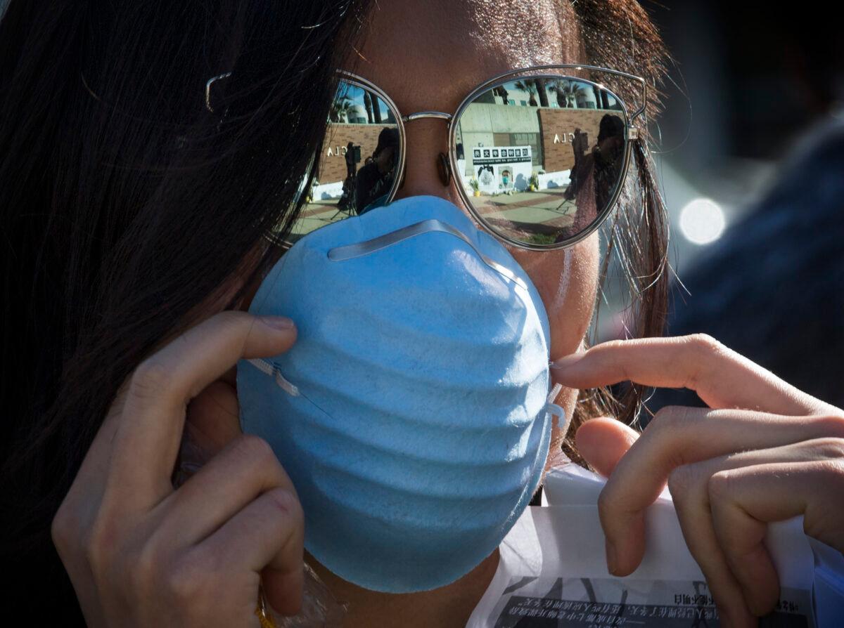 A woman wears a facemask in Westwood, California, in a Feb. 15, 2020, file photograph. (Mark Ralston/AFP via Getty Images)