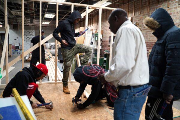 Young people learn construction skills at Chicago's Project H.O.O.D. on Feb. 17, 2020. (Cara Ding/The Epoch Times)