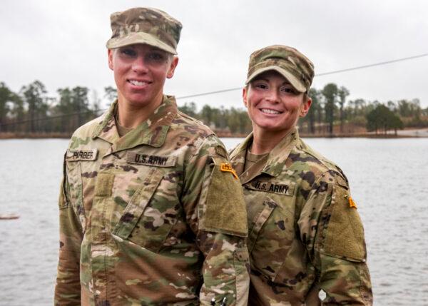 Nearly 20 percent of those serving in the U.S. military are women, according to the DOD, such as U.S. Army Sgt. Danielle Farber (L), a Pennsylvania National Guard 166th Regional Training Institute Medical Battalion Training Site instructor, and Staff Sgt. Jessica Smiley (R), a South Carolina National Guard military police officer, training together at Fort Benning, Ga. (Sgt. Brian Calhoun/South Carolina National Guard)
