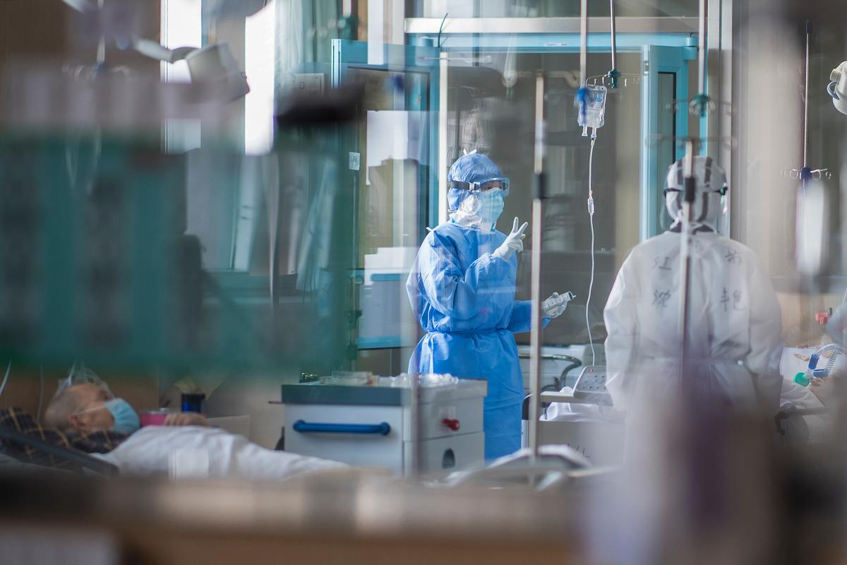 Nurses work at an ICU ward specialized for patients infected by coronavirus in Wuhan in central China's Hubei Province, on Feb. 22, 2020. (Xiao Yijiu/Xinhua via AP)