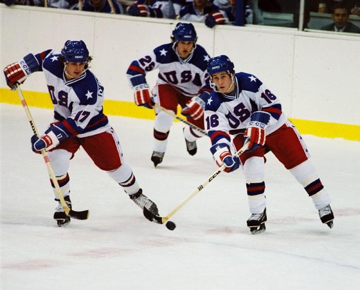 (L–R) Jack O'Callahan (Michael Mantenuto), Buzz Schneider (Billy Schneider, playing his dad), and Mark Pavelich (Chris Koch) chase the puck in “Miracle.” (Chris Large/Buena Vista Pictures Distribution/Disney)