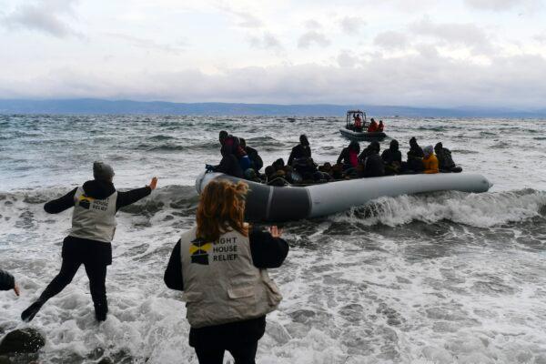 Migrants onboard a dinghy arrive at the village of Skala Sikaminias, on the Greek island of Lesbos, after crossing the Aegean sea from Turkey on Feb. 29, 2020. (Michael Varaklas/AP Photo)