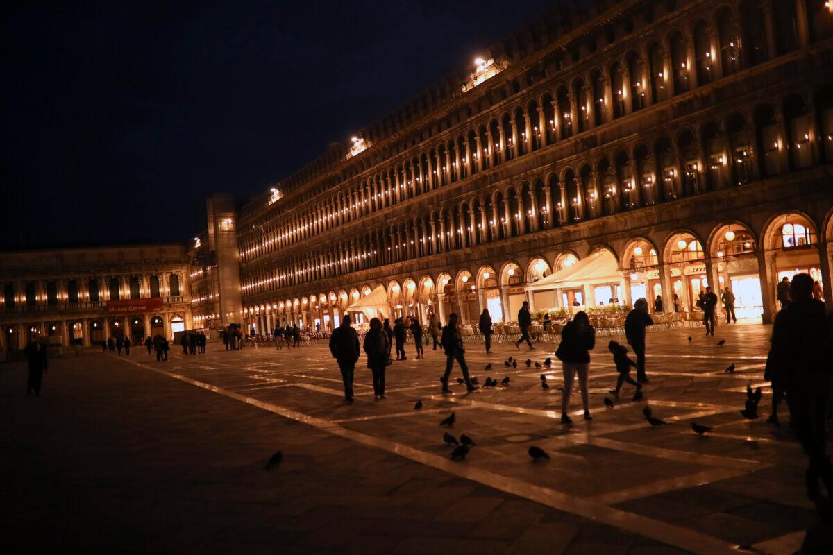 People walk along St. Mark's Square in Venice, Italy on Feb. 29, 2020. (Francisco Seco/AP Photo)