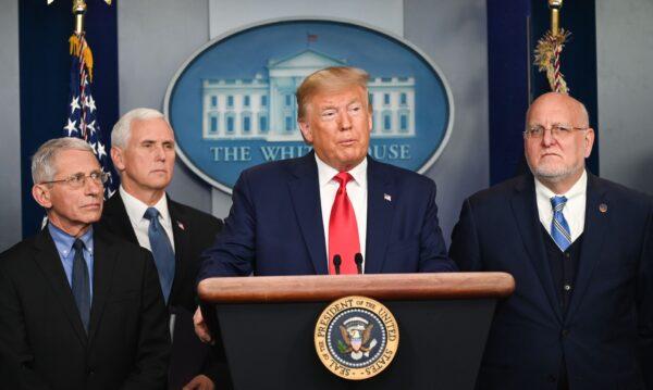 President Donald Trump speaks as Director of the National Institute of Allergy and Infectious Diseases at the National Institutes of Health Anthony Fauci (L), US Vice President Mike Pence (2L), and  Director of the Centers for Disease Control and Prevention Robert Redfield (R) look on during a press conference on the COVID-19, coronavirus, outbreak at the White House in Washington on Feb. 29, 2020. (Roberto Schmidt/AFP via Getty Images)