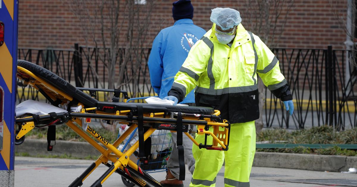 An ambulance worker sprays disinfectant on a stretcher outside The Brooklyn Hospital Center during the coronavirus disease (COVID-19) outbreak in the Brooklyn borough of New York City, New York, U.S., March 31, 2020. (Brendan Mcdermid/Reuters)