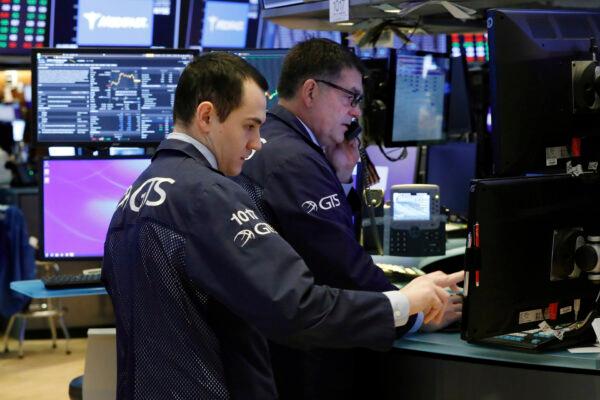 Specialists prepare for the day's trading activity on the floor of the New York Stock Exchange on March 2, 2020. (Richard Drew/AP Photo)