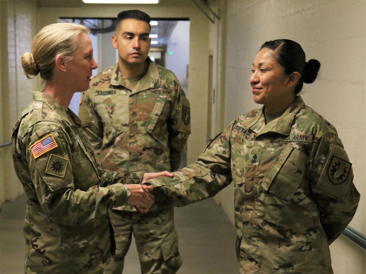 Yeager (L) shakes hands with U.S. Army 1st Sgt. Janet Bretado (R) at Long Beach Armory in California on Oct. 19, 2019. (Photo courtesy of DVIDSHUB | <a href="https://www.dvidshub.net/image/5850355/maj-gen-laura-yeager-visits-224th-sb">Staff Sgt. Matthew Ramelb</a>)