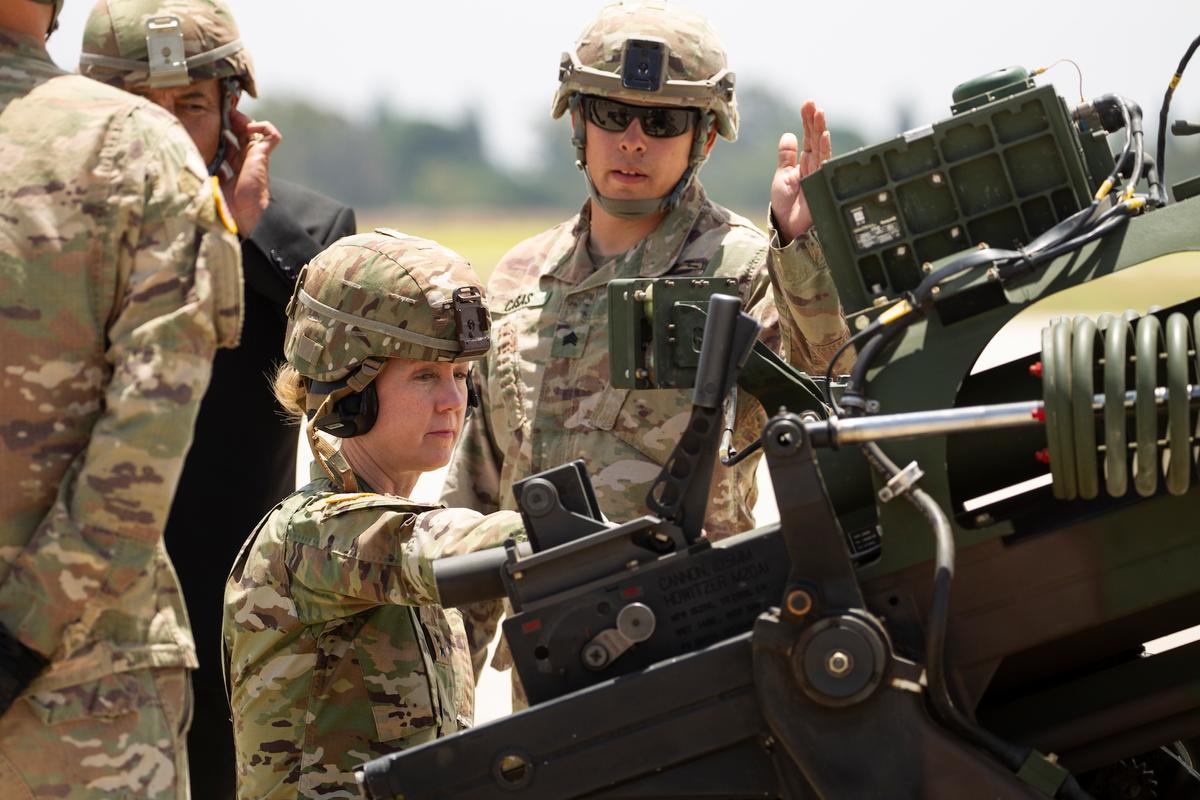 Yeager receiving a hands-on demonstration of the M119 Light Howitzer by soldiers on the Los Alamitos Army Airfield, California, on June 29, 2019 (Photo courtesy of DVIDSHUB | <a href="https://www.dvidshub.net/image/5544325/yeager-fires-with-1st-battalion-143rd-field-artillery">Crystal Housman</a>)