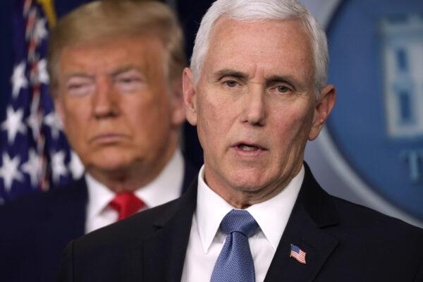 U.S. President Donald Trump listens as Vice President Mike Pence speaks during a news conference at the White House in Washington on Feb. 29, 2020. (Alex Wong/Getty Images)