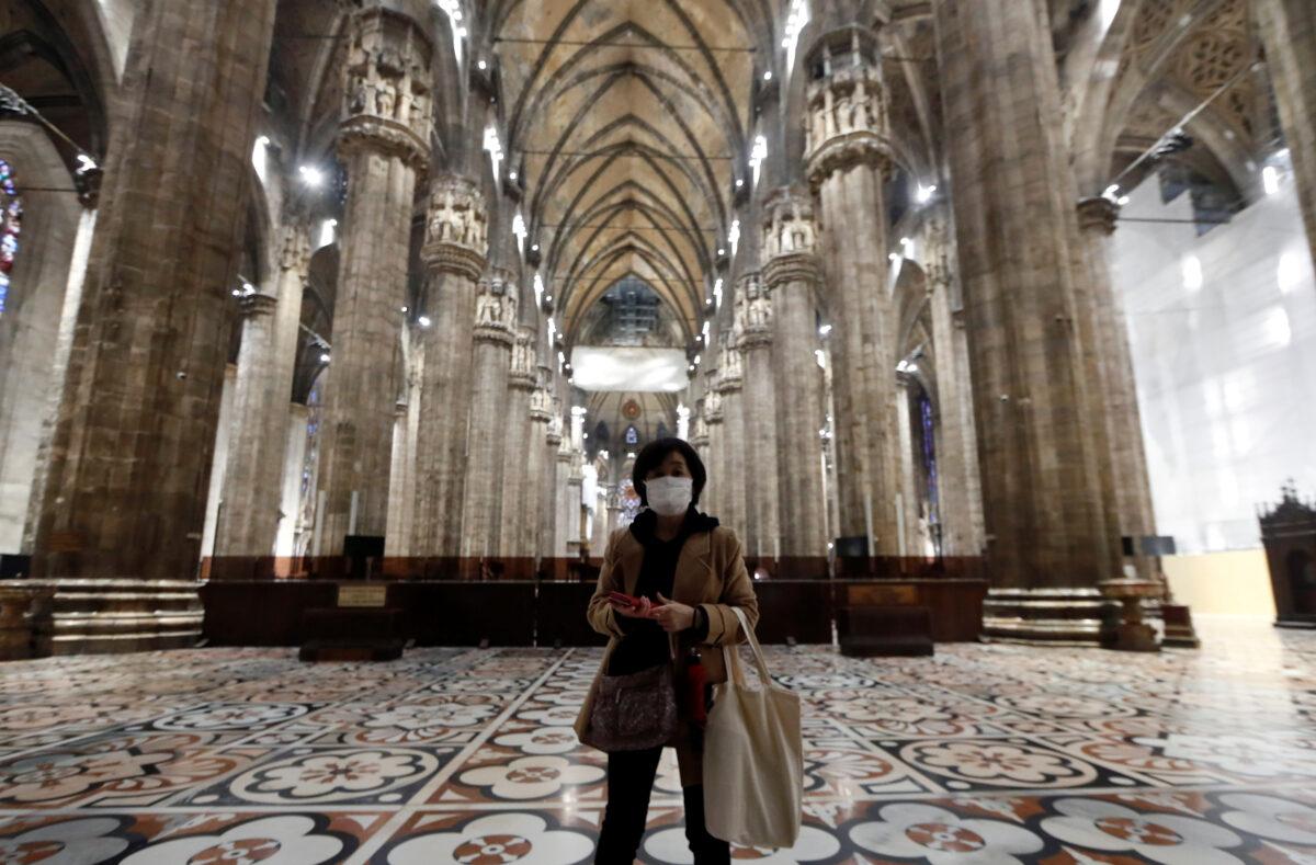 A tourist visits Milan's Duomo cathedral, as it reopened to the public for the first time since the coronavirus outbreak in northern Italy, in Milan, Italy, on March 2, 2020. (Yara Nardi/Reuters)