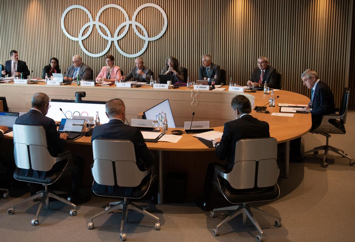 International Olympic Committee (IOC) President Thomas Bach (R) from Germany attends the opening of the executive board meeting of the IOC at the Olympic House in Lausanne, Switzerland, on March 3, 2020. (Laurent Gillieron/Keystone via AP)