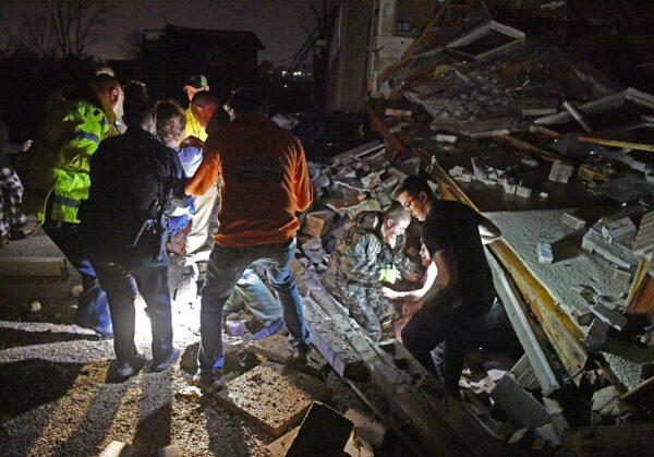 Rescue workers free Bill and Shirley Wallace from their home that collapsed, trapping them under rubble after a tornado hit area in Mt. Juliet, Tenn., on March 3 2020. (Larry McCormack/The Tennessean via AP)