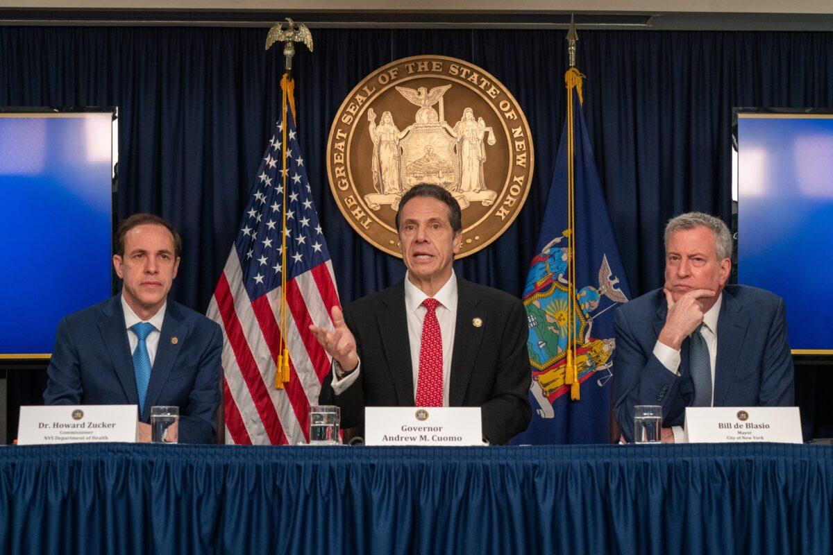 New York state Gov. Andrew Cuomo (C), New York City Mayor Bill DeBlasio (R), and New York state Department of Health Commissioner Howard Zucker hold a news conference on the first confirmed case of COVID-19 in New York, on March 2, 2020. (David Dee Delgado/Getty Images)