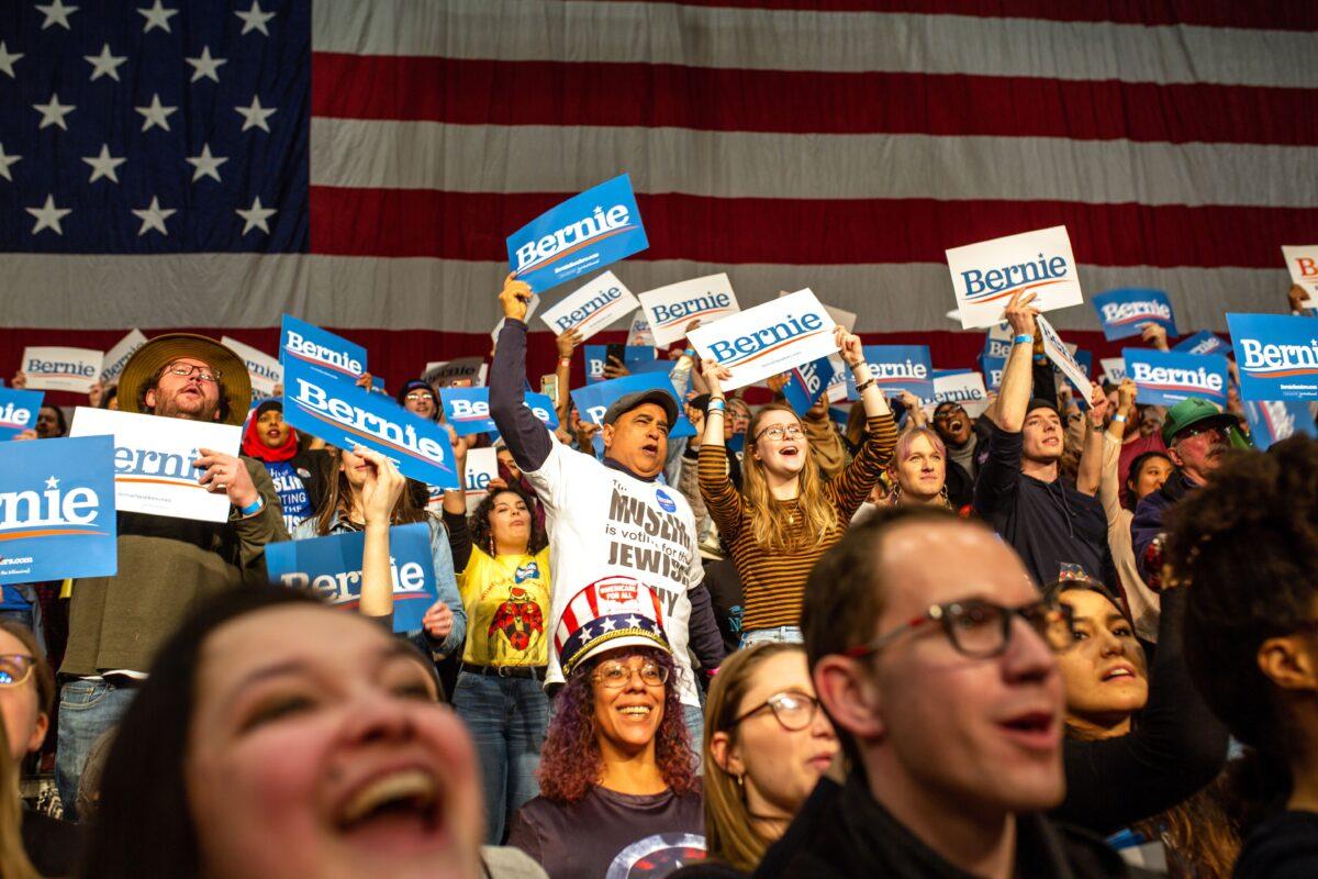 Supporters of Democratic presidential hopeful Sen. Bernie Sanders (I-Vt.) cheer during a rally in Saint Paul, Minnesota, on March 2, 2020. (Kerem Yucel/AFP via Getty Images)