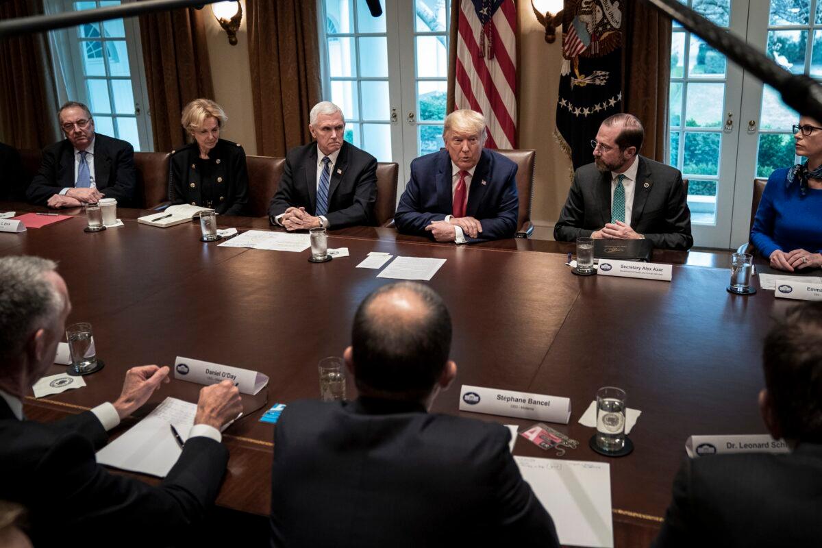 Flanked by Vice President Mike Pence (L) and Secretary of Health and Human Services Alex Azar, President Donald Trump leads a meeting with the White House Coronavirus Task Force and pharmaceutical executives in the Cabinet Room of the White House in Washington on March 2, 2020. (Drew Angerer/Getty Images)