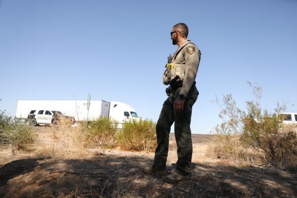 Sheriff's Deputy Ali Martinez stands in the desert next to Interstate 8, a common pick-up spot for illegal aliens and smugglers who evaded Border Patrol at the U.S.–Mexico border and are heading to Phoenix, in Pinal County, Ariz., on Nov. 13, 2019. (Charlotte Cuthbertson/The Epoch Times)