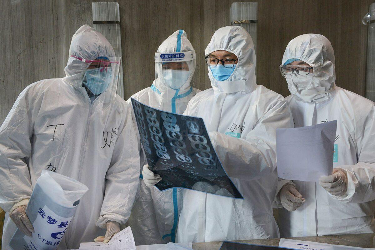 Doctors looking at a lung CT image at a hospital in Yunmeng County, Xiaogan city, in China's Hubei Province on Feb. 20, 2020. (STR/AFP via Getty Images)