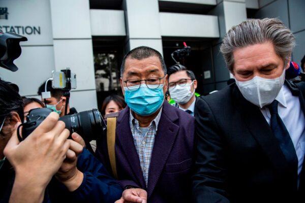 Hong Kong media tycoon and founder of Apple Daily newspaper Jimmy Lai (C) leaves the Kowloon City police station in Hong Kong on Feb. 28, 2020. (Isaac Lawrence/AFP via Getty Images)