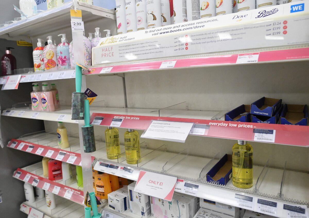 Empty shelves alerting customers to limited sales of antibacterial hand washes and sanitizer gels, inside a Boots store in London, England, on March 3, 2020. (Justin Tallis/AFP via Getty Images)