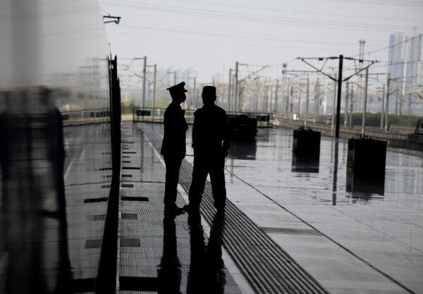 Train conductors are seen as the train stops at the Wuhan railway station on March 4, 2020. (Noel Celis/AFP via Getty Images)