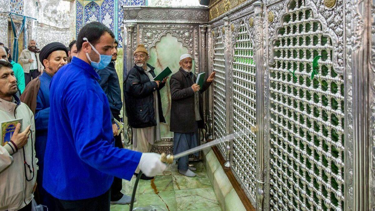 A man disinfects the shrine of Saint Masoumeh against CCP virus in the city of Qom, 78 miles south of the capital Tehran, Iran, on Feb. 24, 2020. (Ahmad Zohrabi/ISNA via AP)