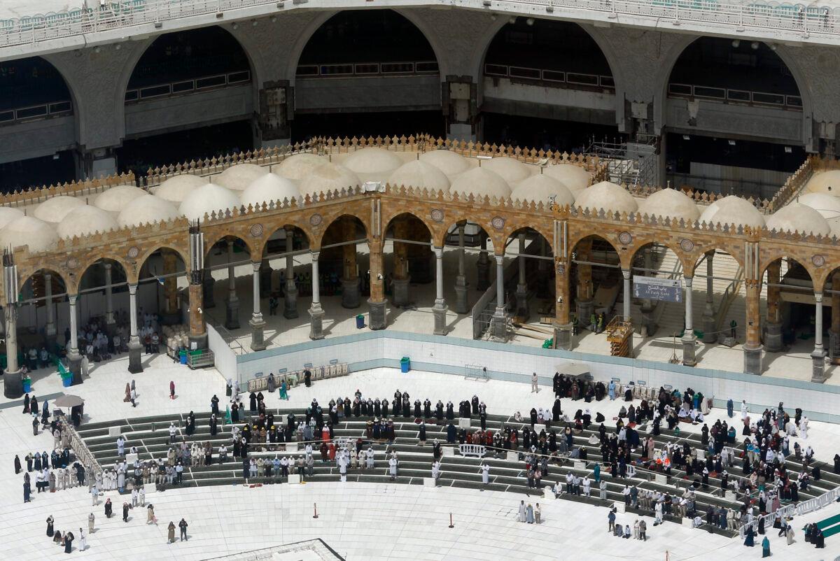 A relatively few number of Muslims pray at the Grand Mosque, in the Muslim holy city of Mecca, Saudi Arabia on March 4, 2020. (Amr Nabil/AP Photo)