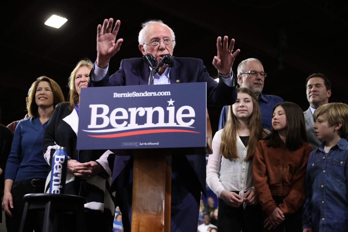 Democratic presidential candidate Sen. Bernie Sanders (I-Vt.) is joined by his family onstage during a rally in Essex Junction, Vt., at the Champlain Valley Expo on March 3, 2020. (Chip Somodevilla/Getty Images)