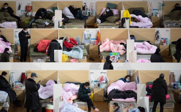 Patients with mild symptoms of the COVID-19 are resting at night in the makeshift hospital set up in a sports stadium in Wuhan, China, on Feb. 18, 2020. (STR/AFP via Getty Images)
