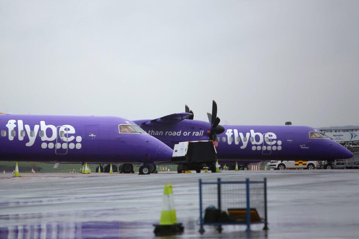 Flybe aircraft are pictured on the tarmac at Exeter airport in southwest England on March 5, 2020, following the news that the airline had collapsed into bankruptcy. (Geoff Caddick/AFP via Getty Images)