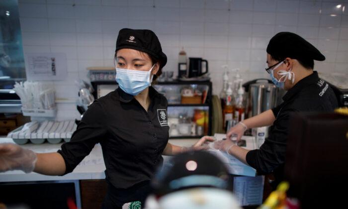 Eating Solo, Avoiding Rush Hour: China Cautiously Returns to Work