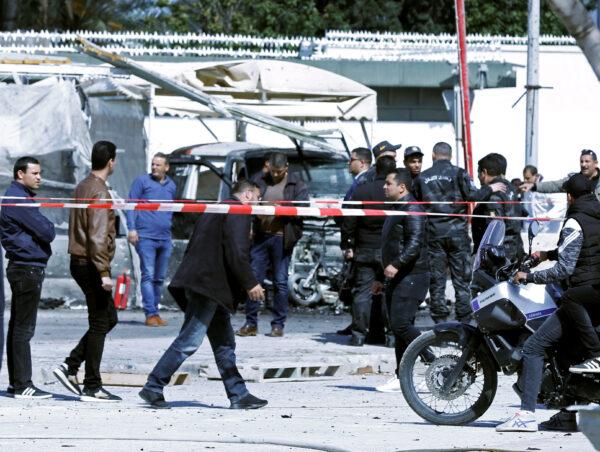 People gather at the site of a suicide attack near the U.S. embassy in Tunis, Tunisia on March 6, 2020. (Zoubeir Souissi/Reuters)