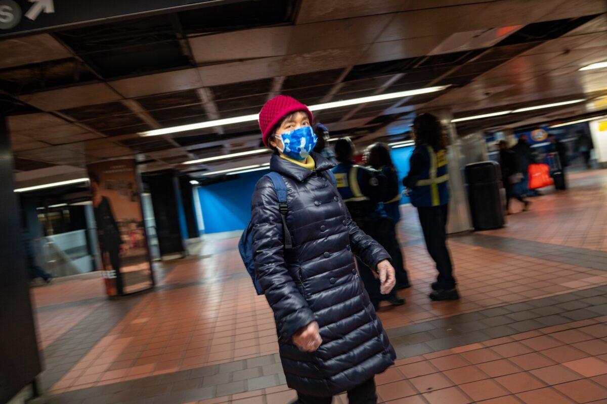 A woman wears a medical mask at Grand Central station in New York City on March 5, 2020. (David Dee Delgado/Getty Images)