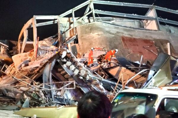 Rescue workers are seen on the site where a hotel being used for the novel coronavirus quarantine collapsed in the southeast Chinese port city of Quanzhou, Fujian province, China on March 7, 2020. (CNS Photo via Reuters)