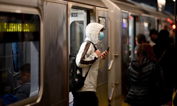 A man wears a face mask as he exits a subway in New York City on March 5, 2020. (Johannes Eisele/AFP via Getty Images)