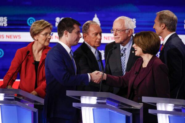 From left, Democratic presidential candidates, Sen. Elizabeth Warren (D-Mass.), former South Bend Mayor Pete Buttigieg, former New York City Mayor Mike Bloomberg, Sen. Bernie Sanders (I-Vt.), Sen. Amy Klobuchar (D-Minn.), and businessman Tom Steyer, greet on another on stage at the end of the Democratic presidential primary debate at the Gaillard Center in Charleston, S.C. on Feb. 25, 2020. All the candidates but Biden and Sanders have since dropped out. (Patrick Semansky/AP Photo)