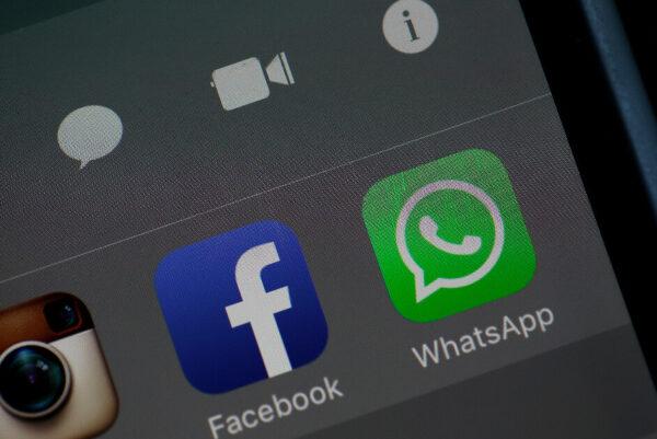The Facebook and WhatsApp apps are displayed on an iPhone in this file photo illustration. (Justin Sullivan/Getty Images)