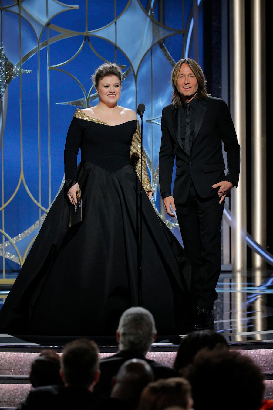 Presenters Kelly Clarkson and Keith Urban speak onstage during the 75th Annual Golden Globe Awards in 2018 in Beverly Hills, California. (©Getty Images | <a href="https://www.gettyimages.com/detail/news-photo/in-this-handout-photo-provided-by-nbcuniversal-presenters-news-photo/902735354?adppopup=true">Paul Drinkwater</a>)