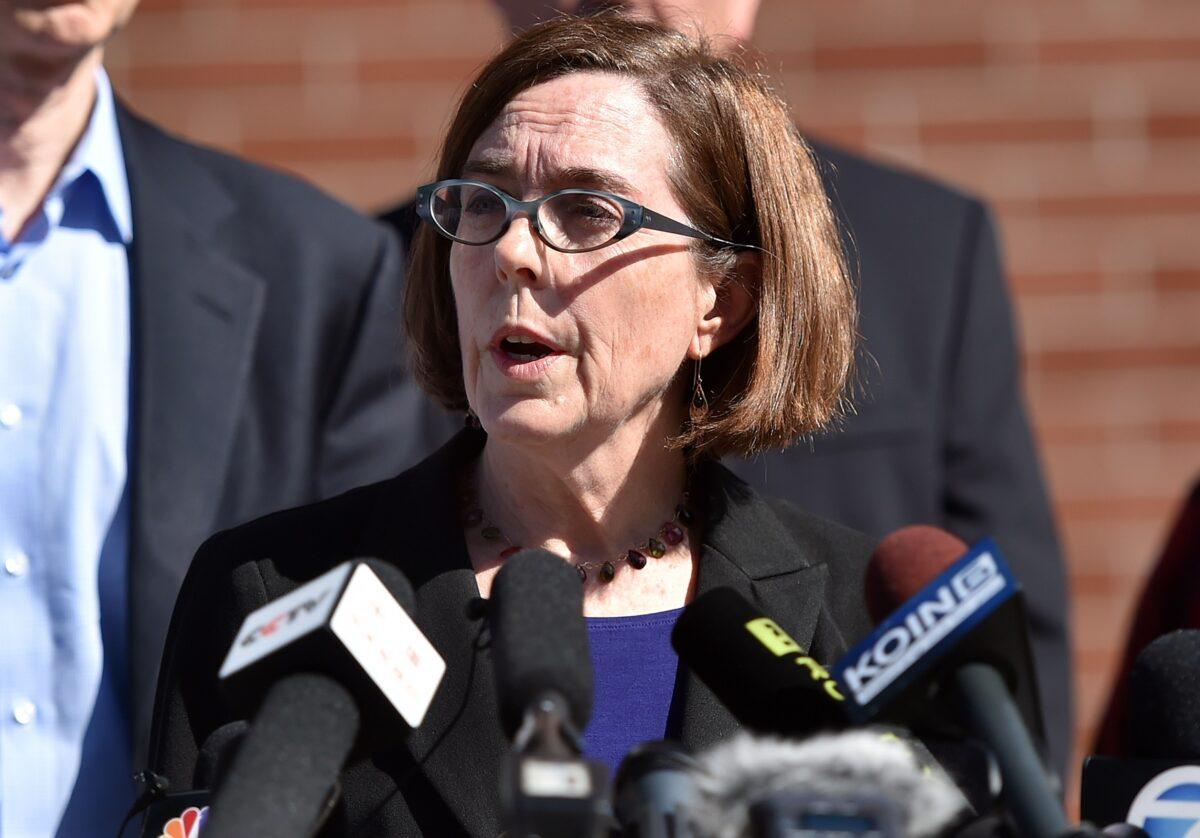 Oregon Governor Kate Brown reacts during a press conference in Roseburg, Oregon, on Oct. 2, 2015. (Josh Edelson/AFP via Getty Images)