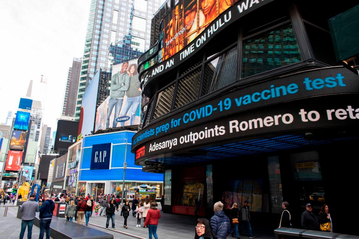 Information related to coronavirus is displayed on a screen in Times Square in New York City on March 8, 2020 (Kena Betancur/AFP via Getty Images)