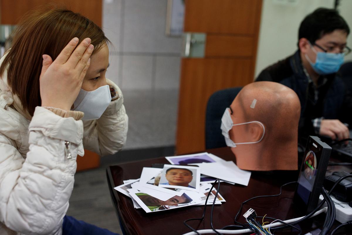 A software engineer tests a facial recognition program that identifies people when they wear a face mask at the development lab of the Chinese electronics manufacturer Hanwang (Hanvon) Technology in Beijing, China, on March 6, 2020. (Thomas Peter/Reuters)