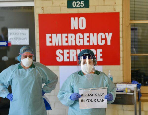 South Australia Hospital staff simulate a drive through coronavirus testing at the Repatriation Hospital in Adelaide, Australia, on March 10, 2020. (AAP Image/David Mariuz)