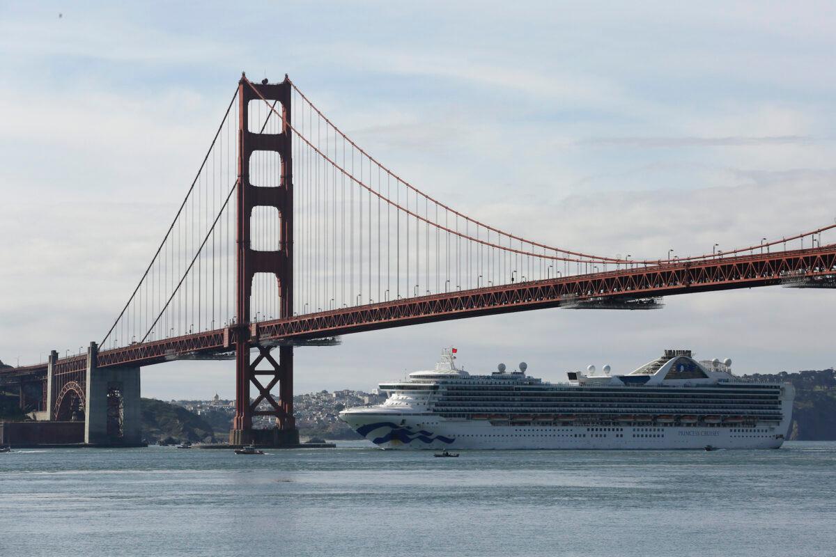 The Grand Princess cruise ship passes beneath the Golden Gate Bridge in this view from Sausalito, Calif., on March 9, 2020. (Eric Risberg/AP Photo)