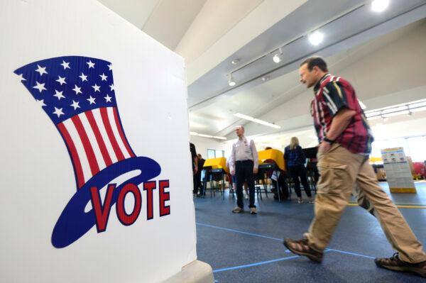 Voters cast their ballots at a voting center in El Segundo, Calif., on March 3, 2020. (AP Photo/Ringo H.W. Chiu)