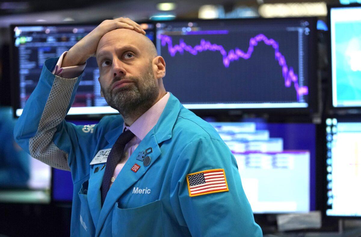 An employee reacts to market data on display at the New York Stock Exchange in New York on March 9, 2020. (Timothy Clary/AFP via Getty Images)
