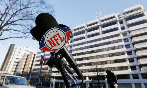 An NFL logo on a microphone is seen before the start of negotiations at the Federal Mediation and Conciliation Service building in Washington, D.C., on March 7, 2011. (Rob Carr/Getty Images)