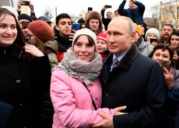 Russian President Vladimir Putin with people in Ivanovo, 158 miles northeast of Moscow, on March 6, 2020. (Alexei Nikolsky, Sputnik, Kremlin Pool Photo via AP)