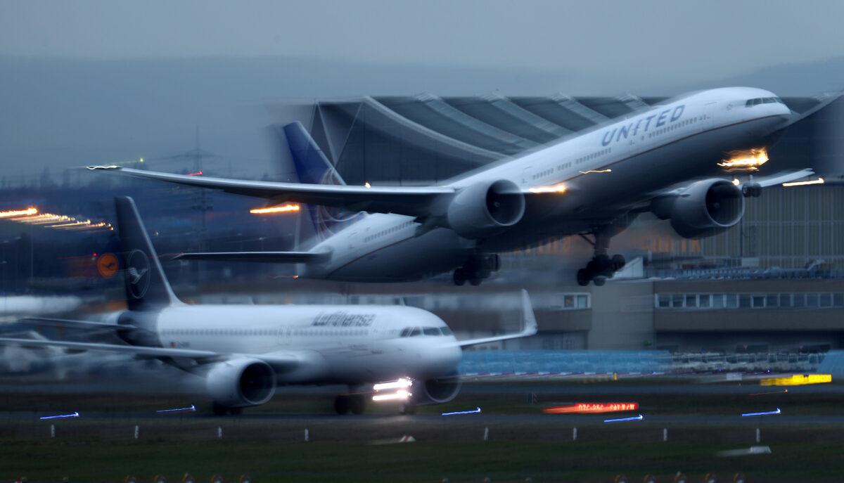 Jetliners of German airline Lufthansa and U.S. carrier United Airlines land and take off at Frankfurt Airport in Germany, on March 2, 2020. (Kai Pfaffenbach/Reuters)